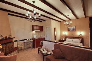 a living room and kitchen with a couch and a living room at Melivoia in Vitina