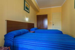 Posteľ alebo postele v izbe v ubytovaní Hostal Urgell