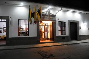 a store front of a building at night at Hotel y Restaurante Colonial Popayan in Popayan