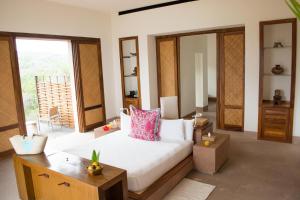 מיטה או מיטות בחדר ב-Imanta Resorts Punta de Mita