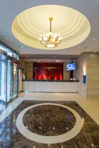 a lobby with a large marble floor and a chandelier at Jinjiang Inn - Beijing Daxing Development Zone in Daxing