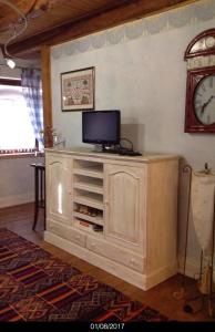 A television and/or entertainment centre at East Wind