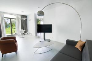 TV a/nebo společenská místnost v ubytování Ca' Barbini Resort