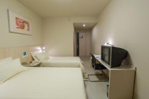 Posteľ alebo postele v izbe v ubytovaní Jinjiang Inn - Beijing Daxing Development Zone