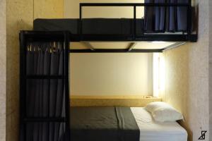 Letto o letti in una camera di Hugger Hostel