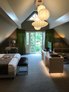 Ένα ή περισσότερα κρεβάτια σε δωμάτιο στο Romantisches Hotel Menzhausen