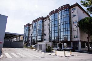 a large building with a parking lot in front of it at StaynFeel 03 in Fátima