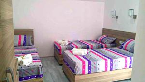 Postelja oz. postelje v sobi nastanitve Atina Lux Hostel