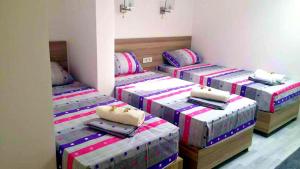 Postelja oz. postelje v sobi nastanitve Atina Lux Hostel