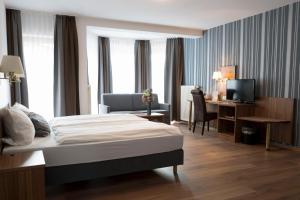 Una cama o camas en una habitación de Hotel am Palais