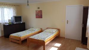 Postel nebo postele na pokoji v ubytování Gościniec Mazurek
