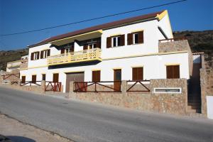 a white building on the side of a road at Lucas House 2 - Seabreeze apartment in Aljezur