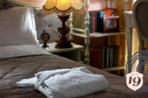 Postel nebo postele na pokoji v ubytování Hotel 19
