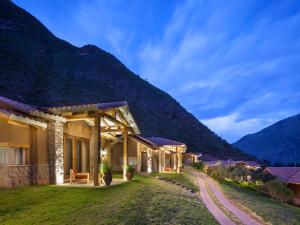 a resort with a mountain in the background at Inkaterra Hacienda Urubamba in Urubamba +44 photos