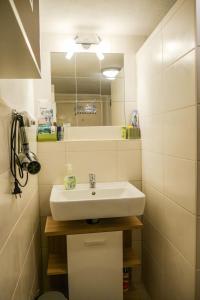 a bathroom with a sink and a mirror at ferienwohnung lispet in Neuötting +18 photos