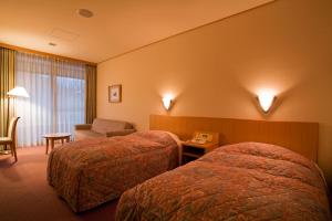 Ένα ή περισσότερα κρεβάτια σε δωμάτιο στο Tamamine Sanso