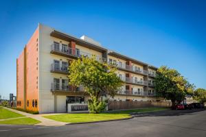 an apartment building with a sign that reads quest at Quest Mildura in Mildura