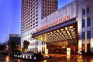 a building with a sign on the side of it at Wanda Realm Taizhou in Taizhou