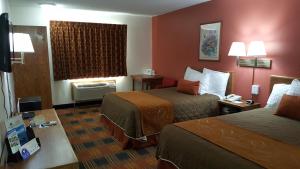 Ένα ή περισσότερα κρεβάτια σε δωμάτιο στο Americas Best Value Inn and Suites - Nevada +26 φωτογραφίες