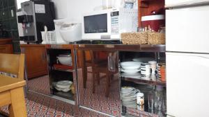 Cucina o angolo cottura di Holiday House Ryukyu-an "MUSIC HOSTEL"