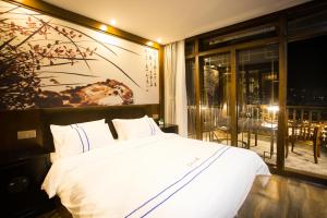Katil atau katil-katil dalam bilik di Wang Jiang Reclusive Boutique Inn