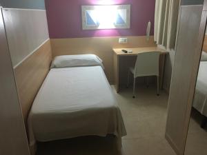 Postel nebo postele na pokoji v ubytování Hostal Ducal