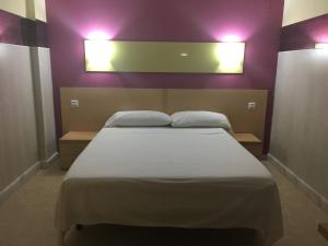 Postel nebo postele na pokoji v ubytování Hostal Ducal
