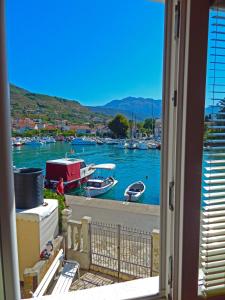 a view of a harbor with boats in the water at Apartmani Sindik in Tivat