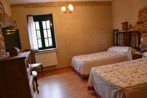 Ein Bett oder Betten in einem Zimmer der Unterkunft La Casa de Rosa