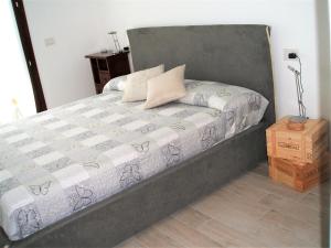 מיטה או מיטות בחדר ב-Green & Lake Home