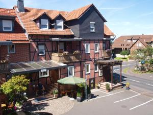 a building with an umbrella in front of it at Landgasthaus Bonn in Baunatal