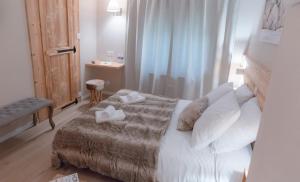 Voodi või voodid majutusasutuse Hotel Les Flocons toas