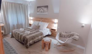 Voodi või voodid majutusasutuse Hotel Les Flocons toas
