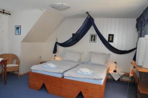 Katil atau katil-katil dalam bilik di Pension Bella Vista