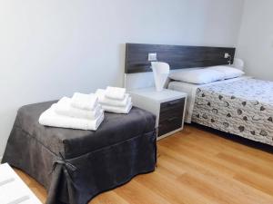 Postel nebo postele na pokoji v ubytování Four Rooms Guesthouse