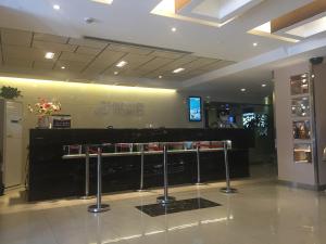 a lobby with a counter in a building at Jinjiang Inn - Beijing Olympic Village Datun Road in Beijing
