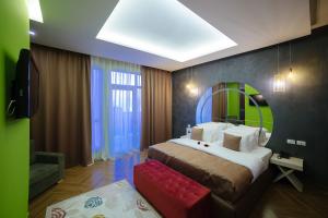 Postel nebo postele na pokoji v ubytování Horizont Hotel