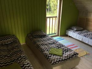Postel nebo postele na pokoji v ubytování Kõveri Holiday Center