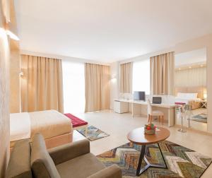 TV a/nebo společenská místnost v ubytování Horizont Hotel