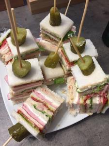 a bunch of sandwiches with pickles on a plate at Villa Torbole in Nago-Torbole