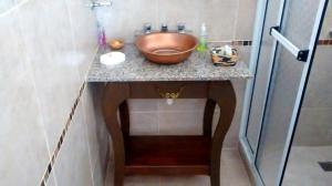 a bathroom with a bowl sink on a counter at Costa Aguacates in Posadas +8 photos