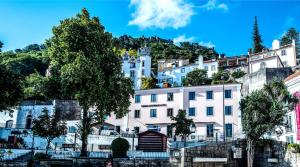 a group of buildings on top of a mountain at Sintra Boutique Hotel in Sintra