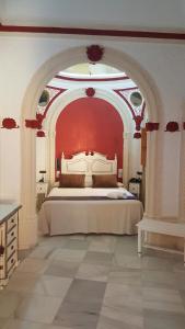Tempat tidur dalam kamar di Hotel Casa Museo de la Mezquita
