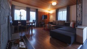 a living room with a couch and a table at Haus Angelika in Vandans