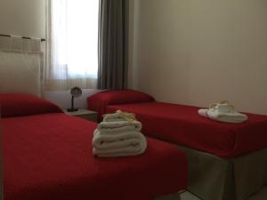 Postel nebo postele na pokoji v ubytování B&B Cinisi Mare e Monti