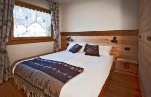 A bed or beds in a room at Chalet Teo e Marianna