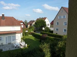 a view of a yard in a town with buildings at Schwarzwald light in Freudenstadt