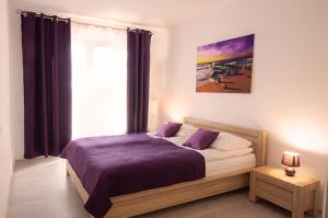 Ein Bett oder Betten in einem Zimmer der Unterkunft Apartament z Garażem Solna 11C/306