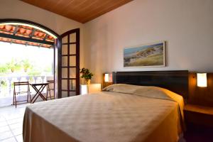 Cama ou camas em um quarto em Pousada Tanto Mar mais 37 fotos