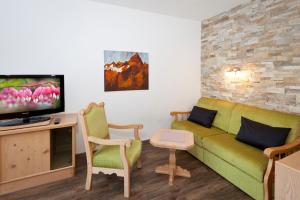 TV a/nebo společenská místnost v ubytování Ferienhaus Auer